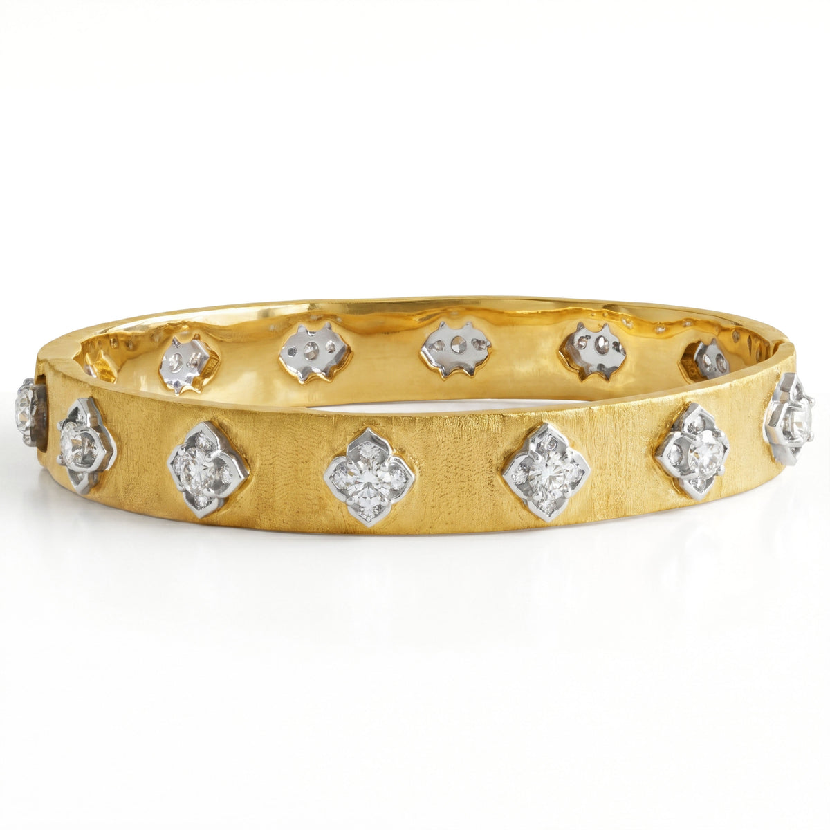Floral diamond bangle in 18K yellow and white gold with brushed matte finish, front view