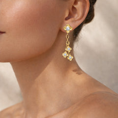 Stambolian Mayflower 18K Gold Dangling Diamond Flower Earrings on White Background