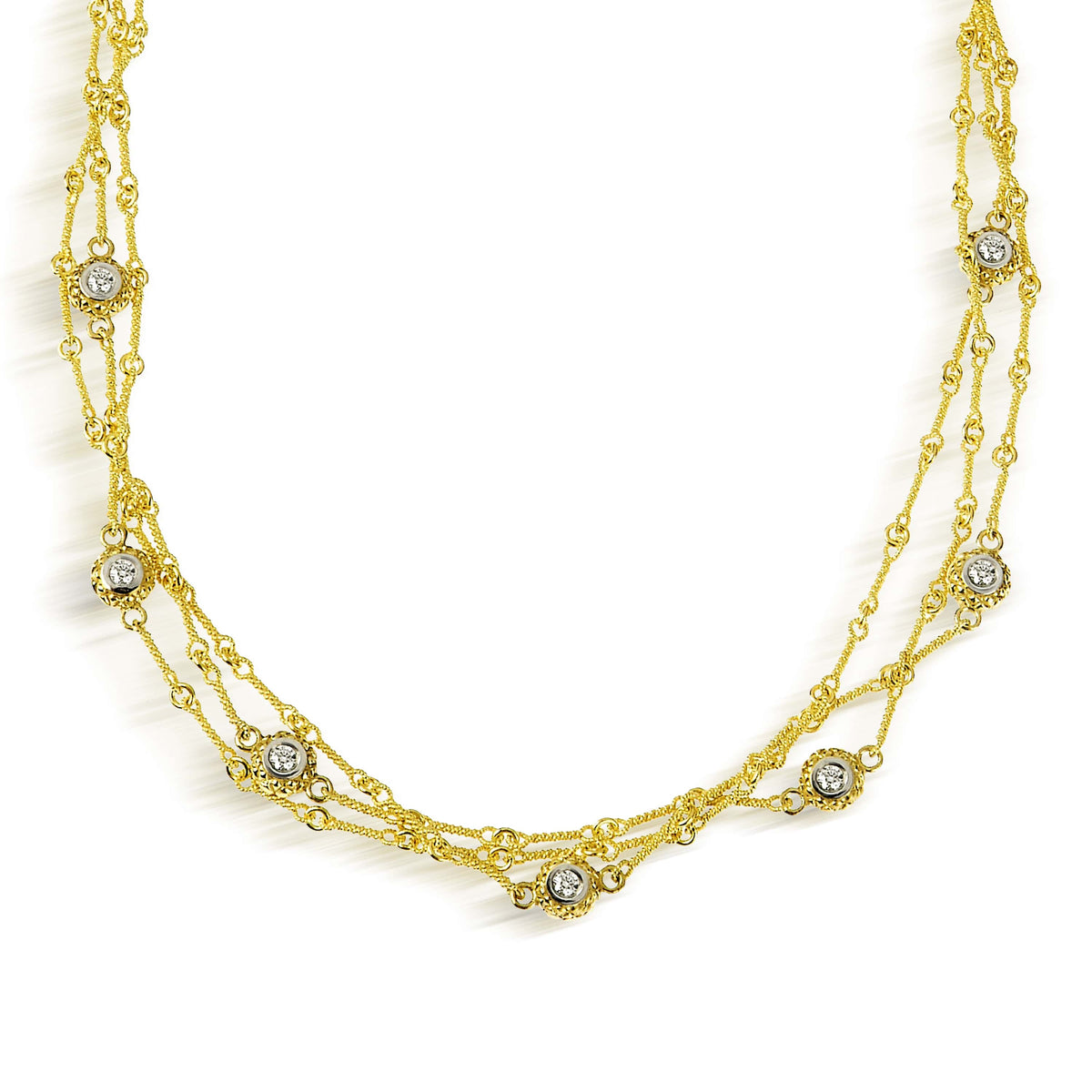 18K yellow gold triple link chain necklace with seven double sided diamond bezels, close-up of the front