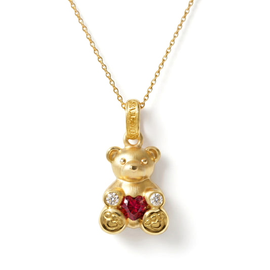 Teddy Bear 18K gold charm pendant with heart shape ruby and diamonds, shown with its chain