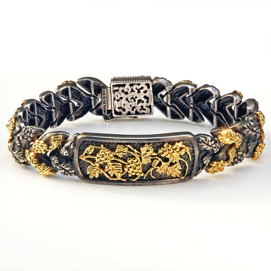 "Napa Valley" grape vine link bracelet in aged silver and 18K gold, front view of the vine plaque and clasp