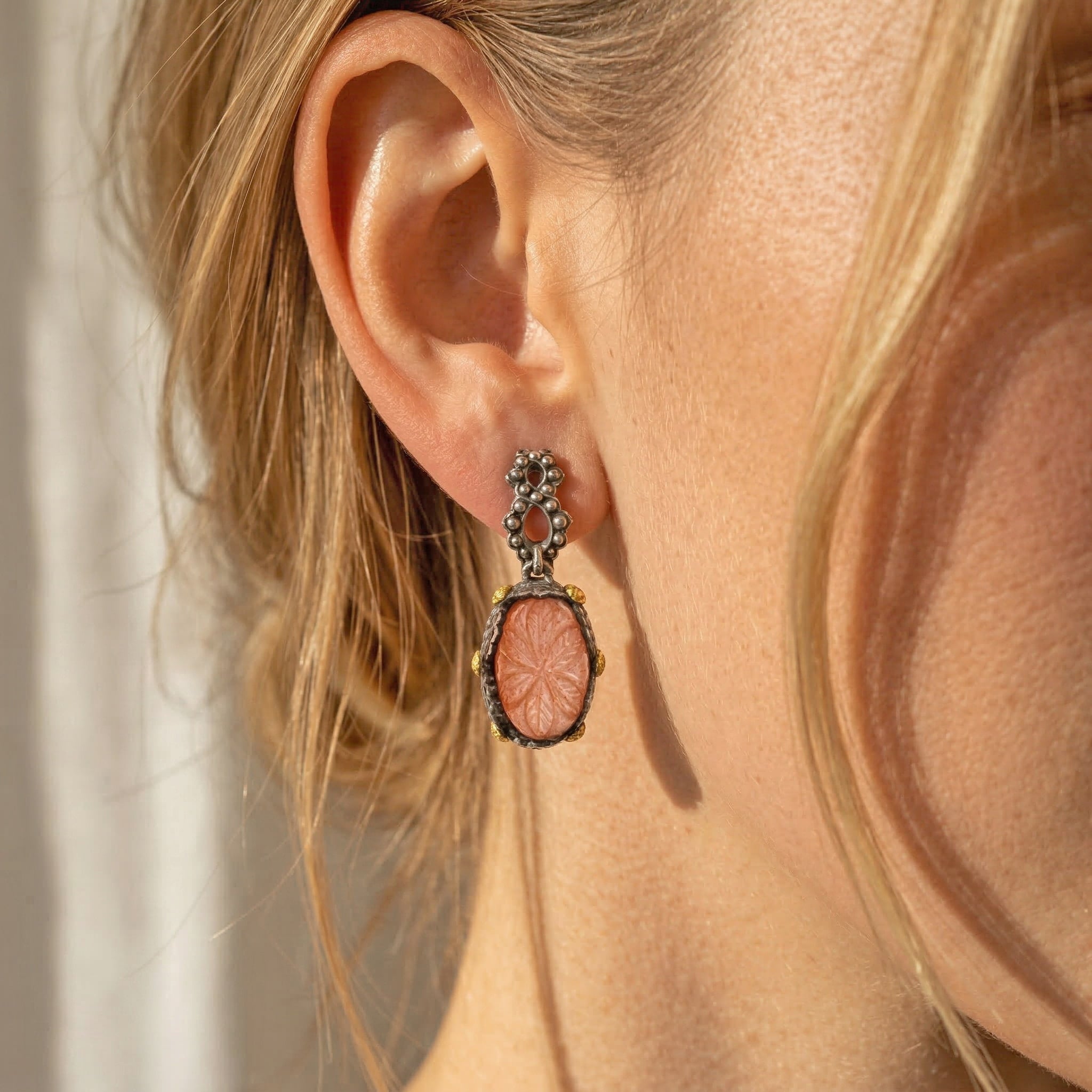 Model Wearing Stambolian Beginnings Peach Moonstone Earrings Showing Drop and Scale