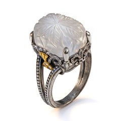 "Beginnings" carved white moonstone and diamond ring in aged silver and 18K gold, angled view