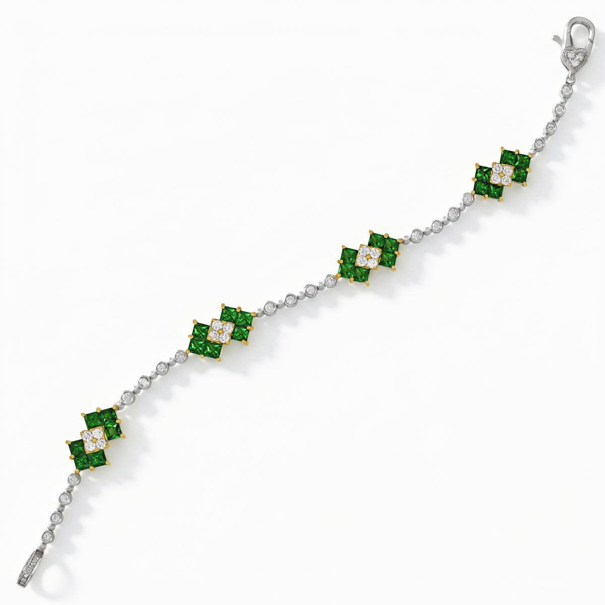 18K white gold bracelet with princess-cut tsavorites and diamonds, top-down view showing the clasp
