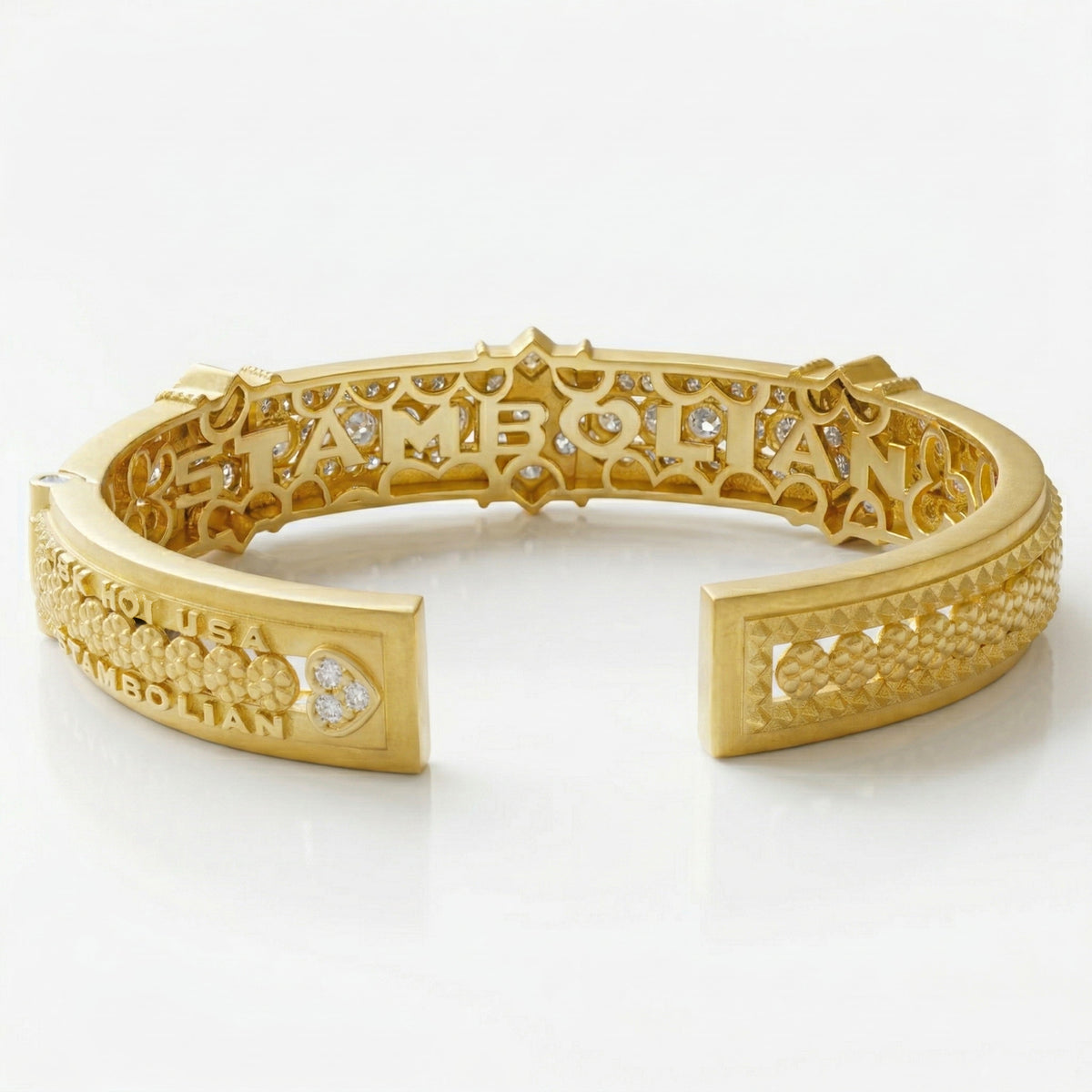 "Passion" diamond bangle bracelet in 18K yellow gold, shown open with the inside of the filigree visible