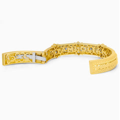 PASSION 18K GOLD AND DIAMOND BANGLE BRACELET