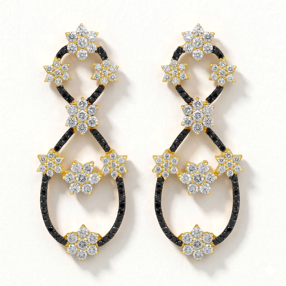 Black and white diamond figure 8 drop earrings in 18K gold, pair shown together, front view