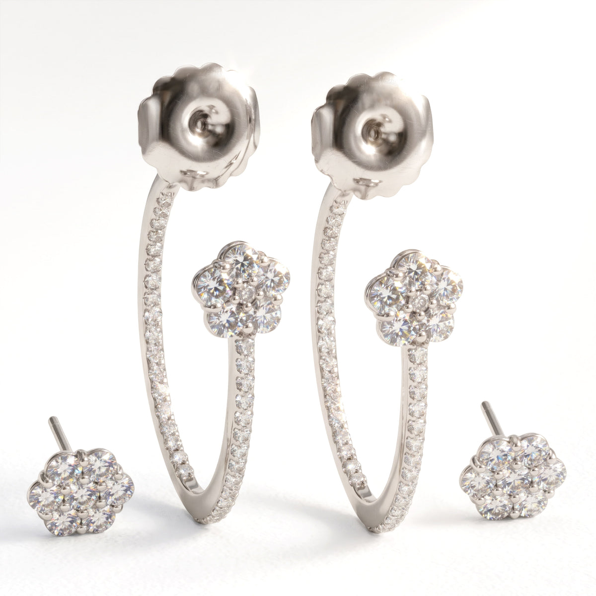 "Happiness" two-piece diamond hoop earrings in 18K white gold, shown with the separate flower studs