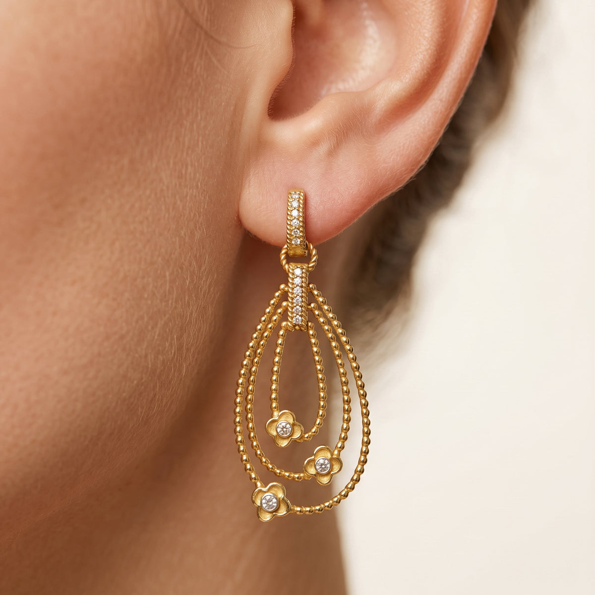 "Mayflower" 18K gold and diamond drop dangle earring, worn on the ear