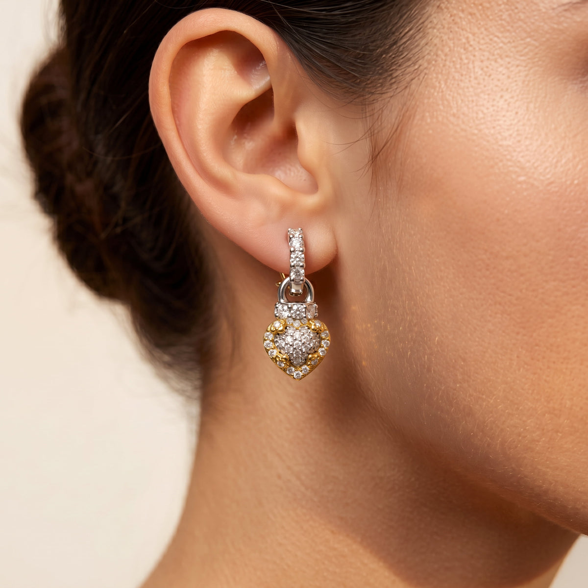"Everything Hearts" 18K two-tone gold diamond heart drop earring, worn on the ear