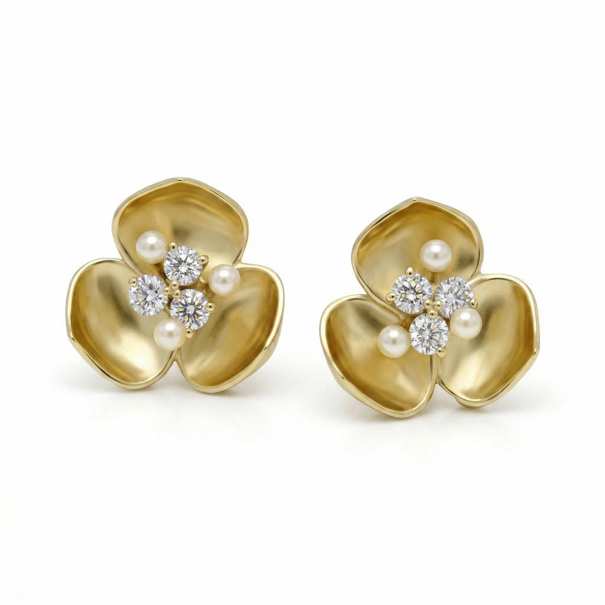 "Blossom" 18K yellow gold floral stud earrings with diamonds and small pearls, pair shown together