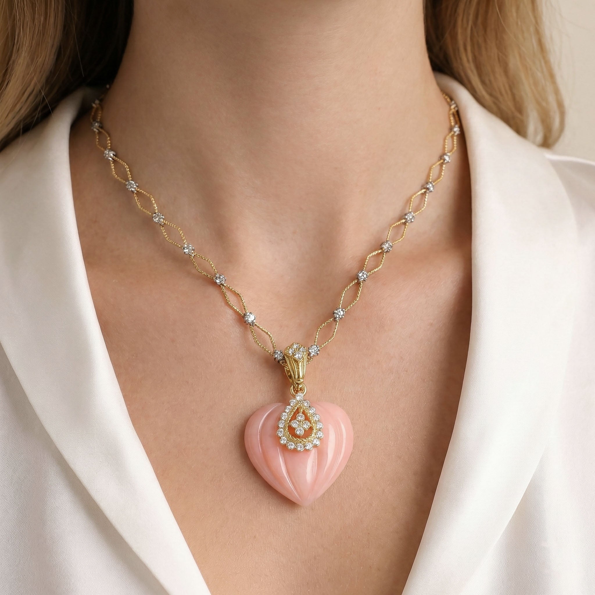 Model Wearing Stambolian Candy Pink Opal Heart Pendant Showing Scale on Gold Chain