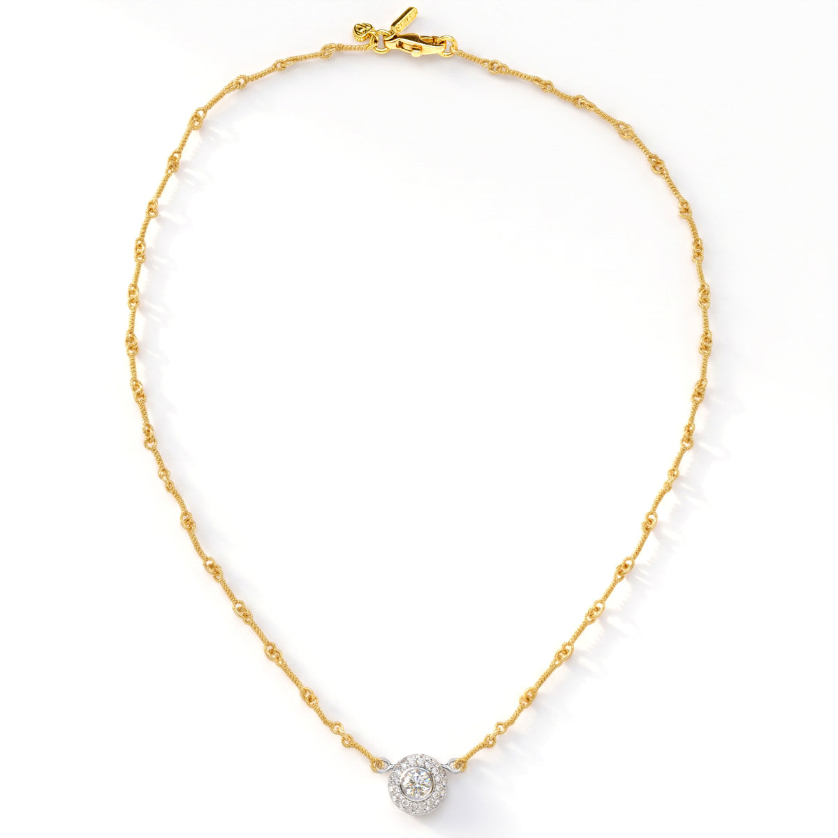 Diamond donut pendant necklace in 18K gold, shown with its full chain and clasp, top-down view