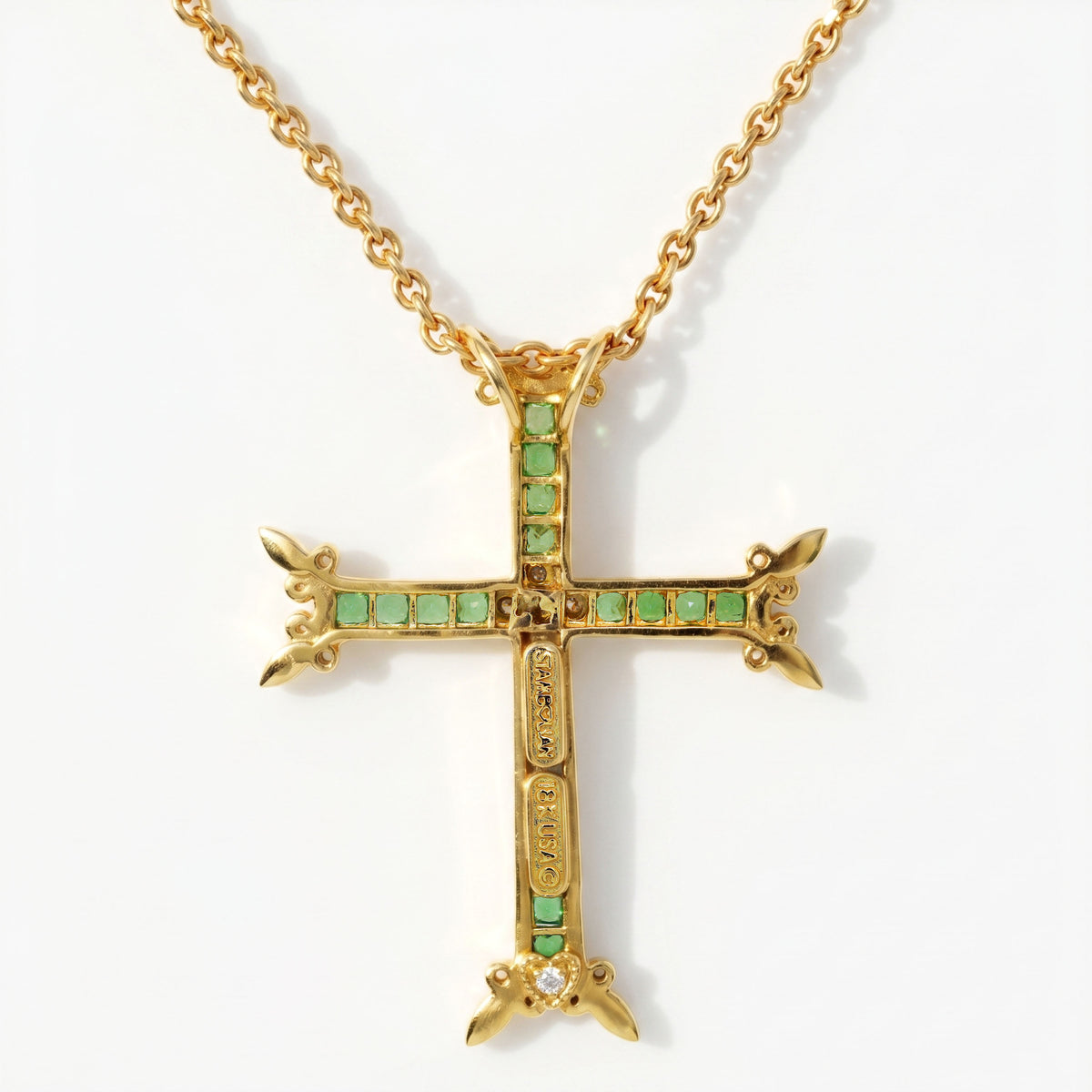 18K gold tsavorite garnet cross pendant, back view showing the open setting and diamond