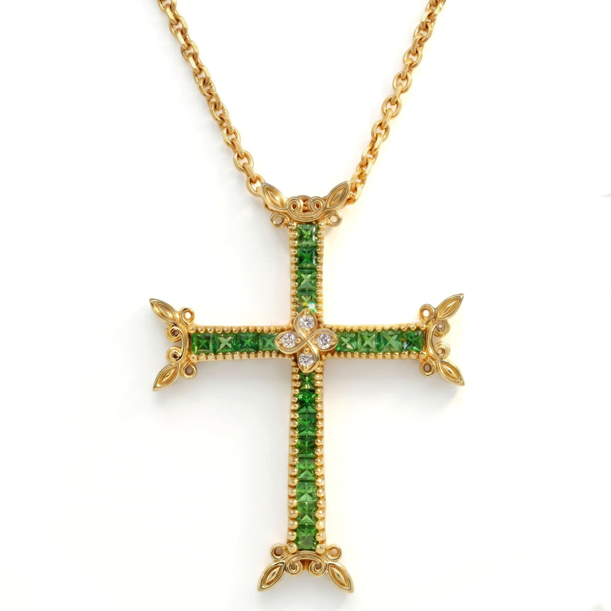 18K gold cross pendant with princess cut tsavorite garnets and diamonds, shown with its chain