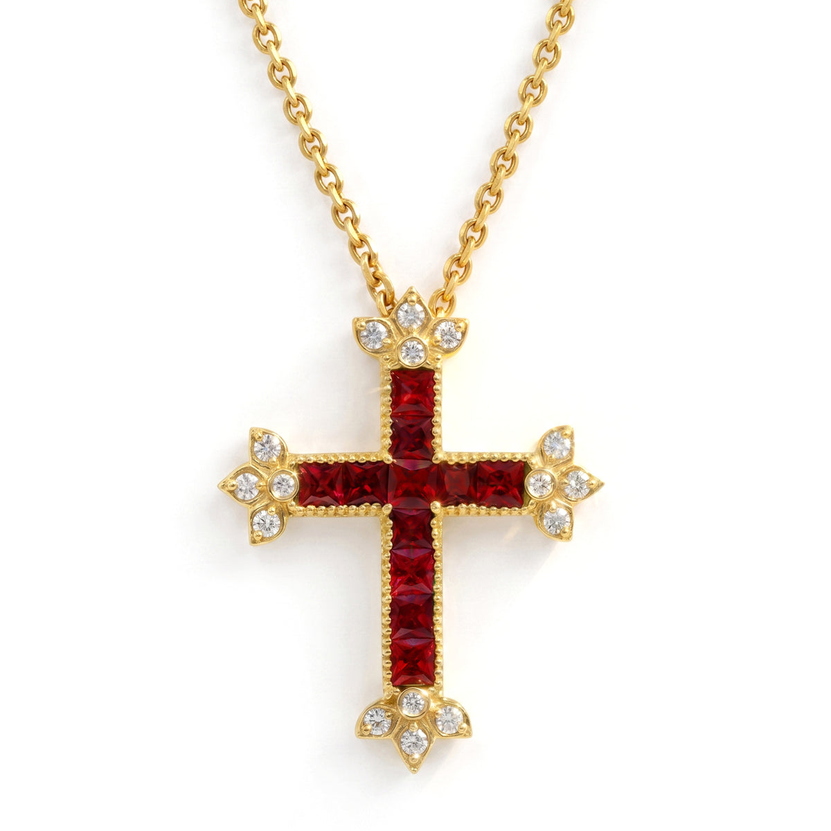 Ruby and diamond cross pendant in 18K gold with princess cut rubies, shown with its chain