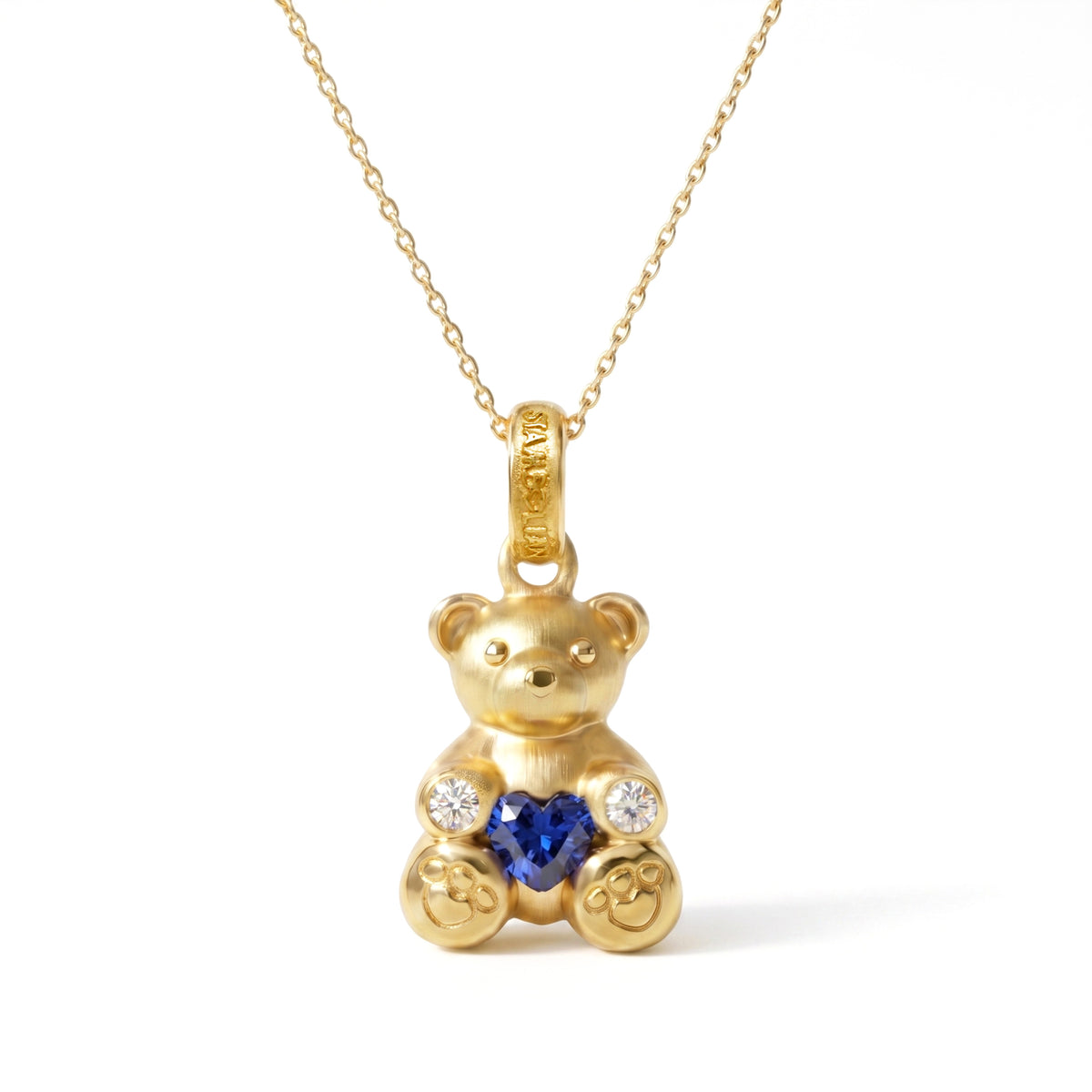 "Teddy Bear" 18K gold charm pendant with heart shape blue sapphire and diamonds, shown with its chain