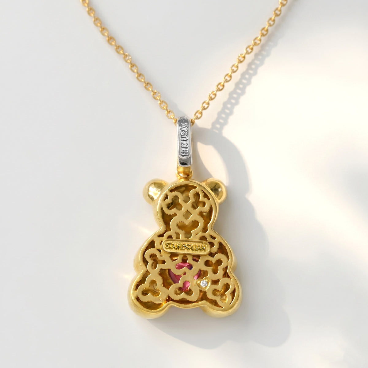 "Teddy Bear" 18K yellow gold charm pendant with pink sapphire heart, back view showing the signature