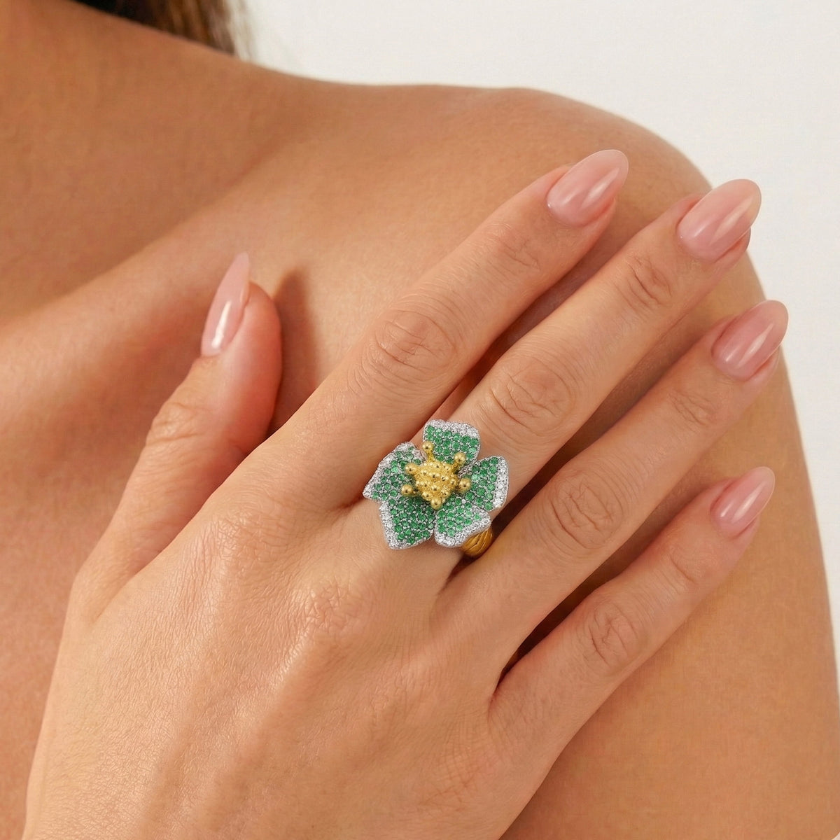 "Enchanted Garden" 18K gold tsavorite and diamond flower ring, worn on the hand