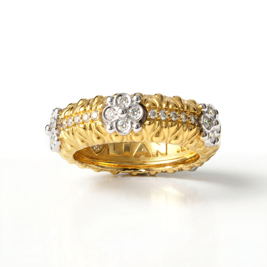 Diamond flower band ring in 18K two tone yellow and white gold, angled front view