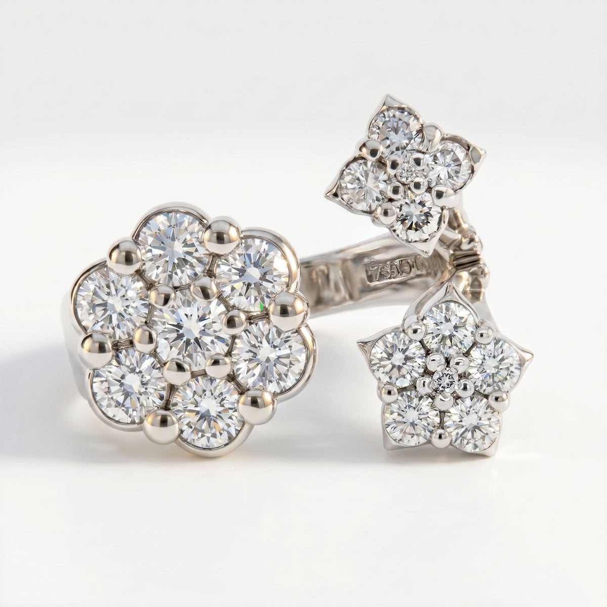 "Diamond Fantasies" three cluster diamond ring in 18K white gold, close-up of the diamond flower clusters