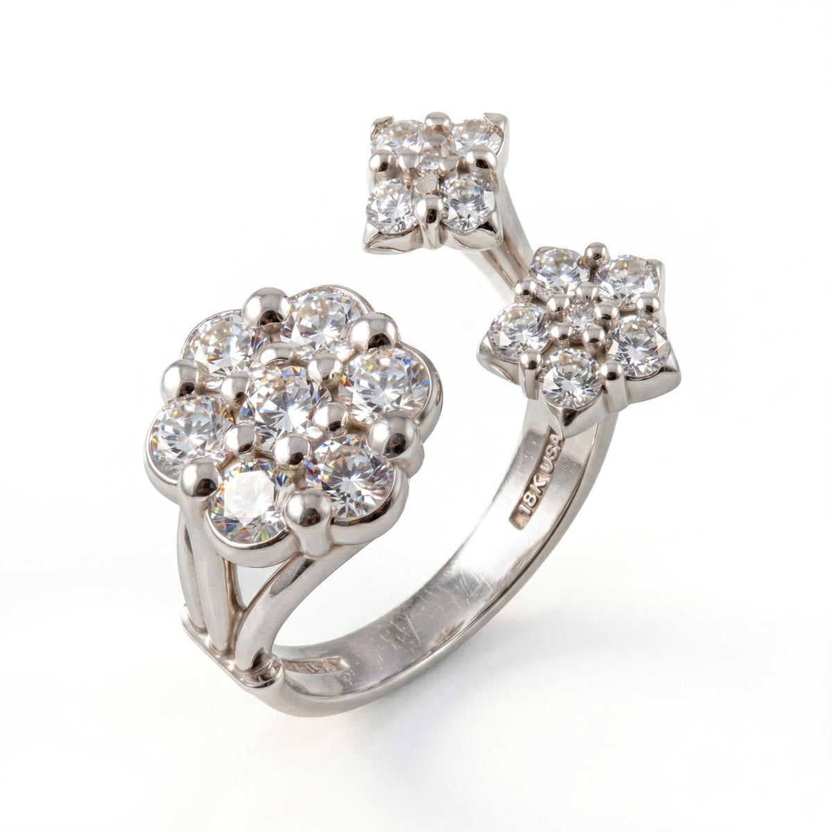 "Diamond Fantasies" three cluster diamond ring in 18K white gold, angled view of the open band