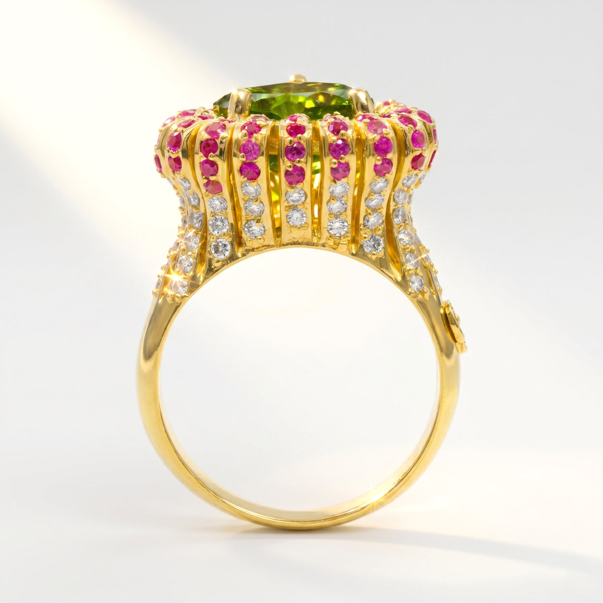 "Sweetheart" 18K gold peridot ring with pink sapphires and diamond-set sides, side view of the shank