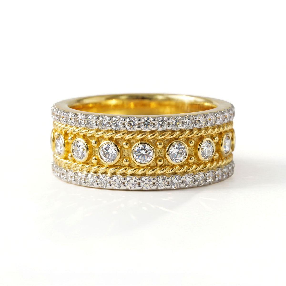 Three-row diamond band ring in 18K two-tone gold with bezel-set center diamonds, front view