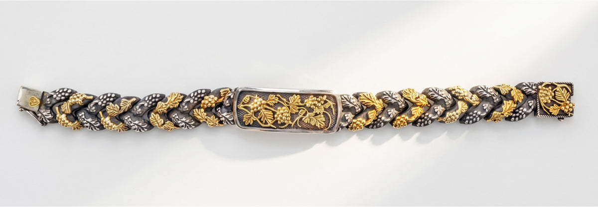 "Napa Valley" grape vine link bracelet in aged silver and 18K gold, full length laid flat