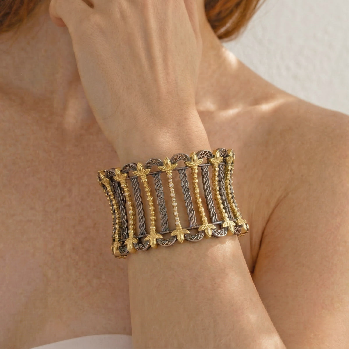 "Cleopatra" aged silver and 18K gold cuff bracelet with diamonds, worn on the wrist