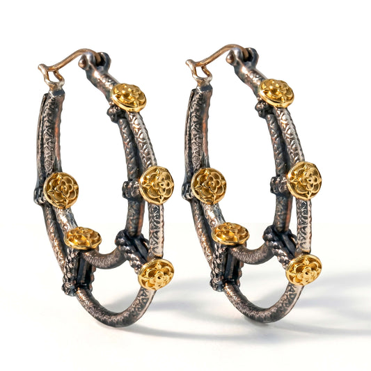 "Circle of Life" inside-out hoop earrings in aged silver and 18K gold, pair shown together