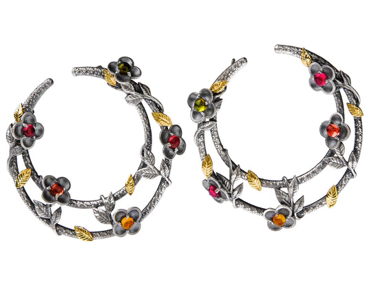 "Beginnings" floral side hoop earrings in aged silver and 18K gold with tourmalines and diamonds, pair shown together