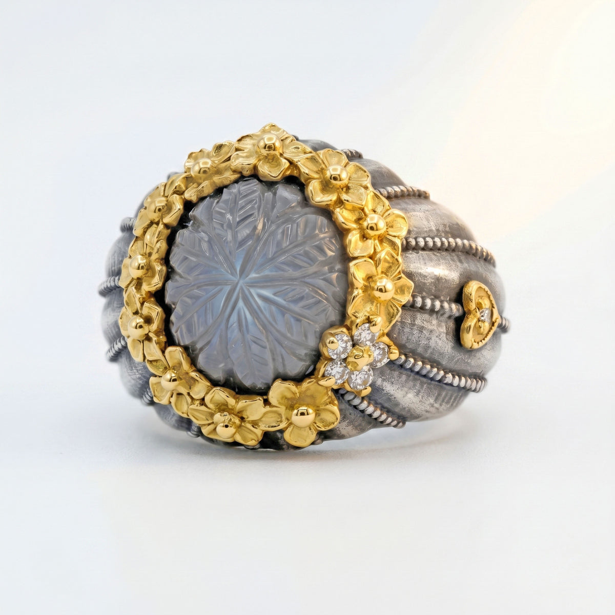 "Bouquet of Dreams" carved grey moonstone ring in aged silver and 18K gold with gold flowers, front view