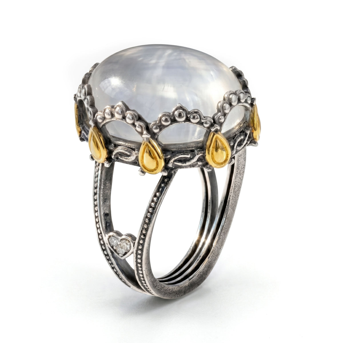 "Princess Tiara" aged silver and 18K gold ring with white moonstone center and diamond heart, angled view