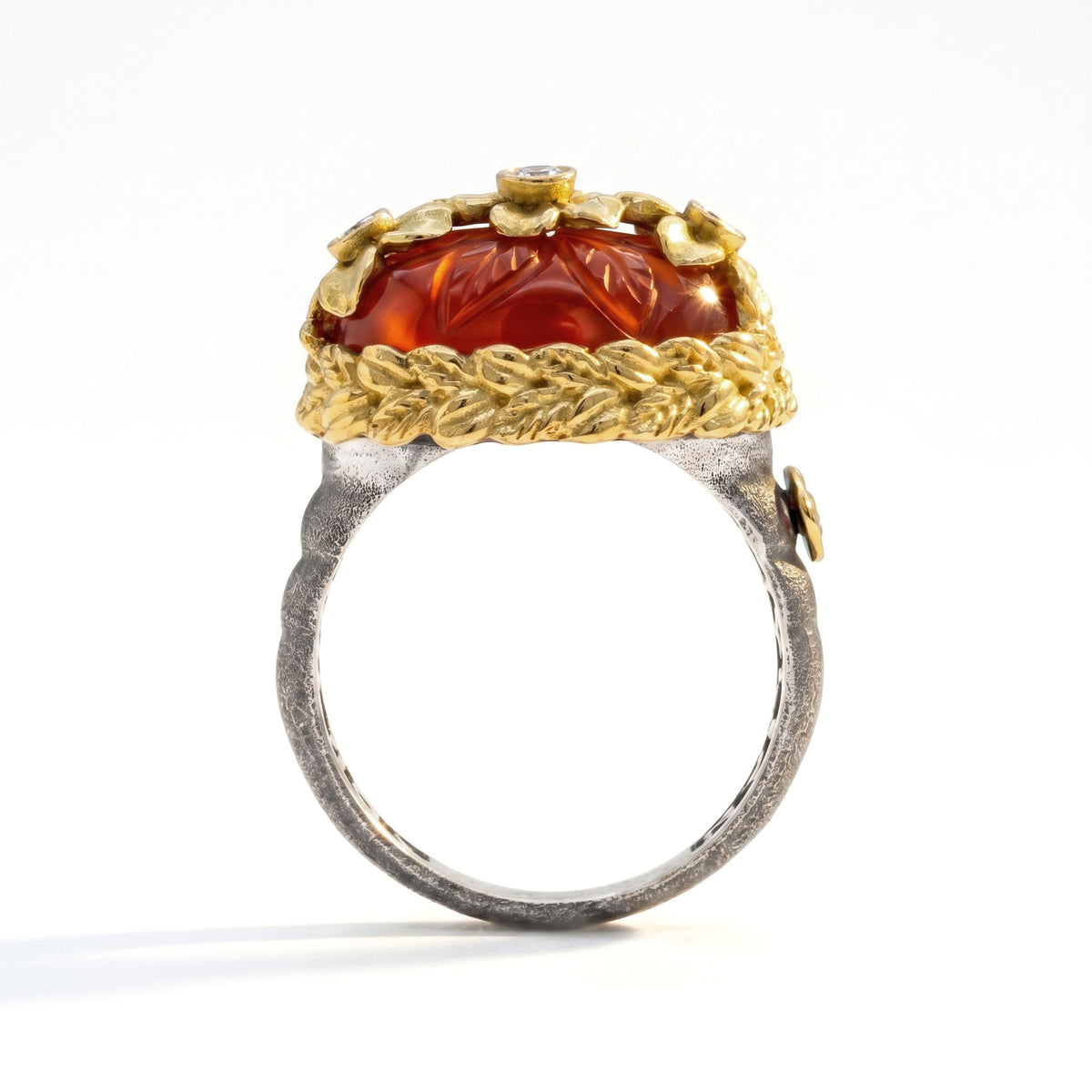 "Beginnings" aged silver and 18K gold carved carnelian ring with diamond flowers, side view