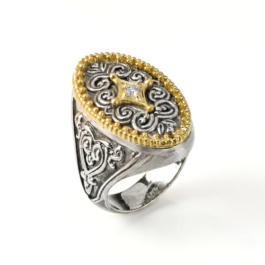 "Beginnings" diamond oval signet ring in aged silver and 18K gold with scrollwork, angled view