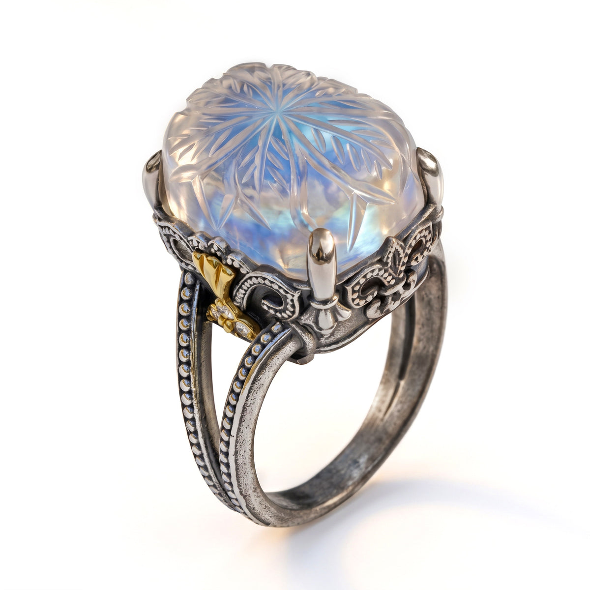 "Beginnings" ring in aged silver and 18K gold with carved rainbow moonstone center, angled view
