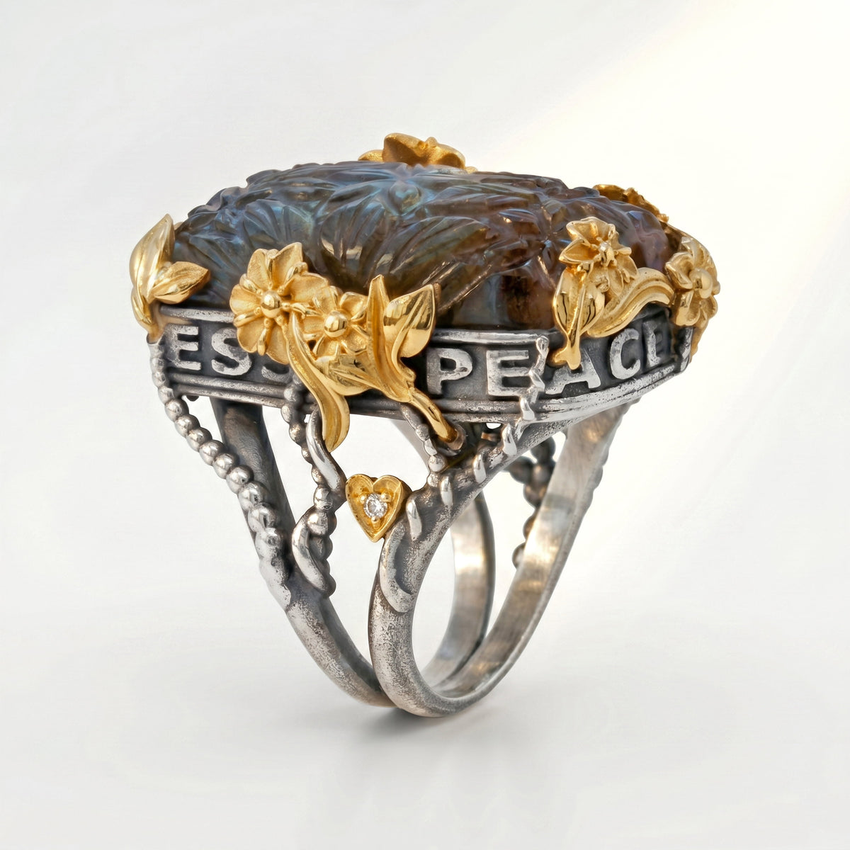 "Peace, Love & Happiness" carved labradorite floral ring in aged silver and 18K gold, angled view of the lettering