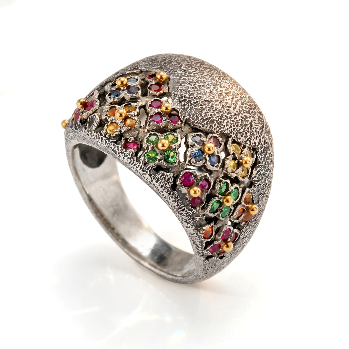 Beginnings multi color sapphire floral ring in aged silver and 18K gold, angled view of the domed band